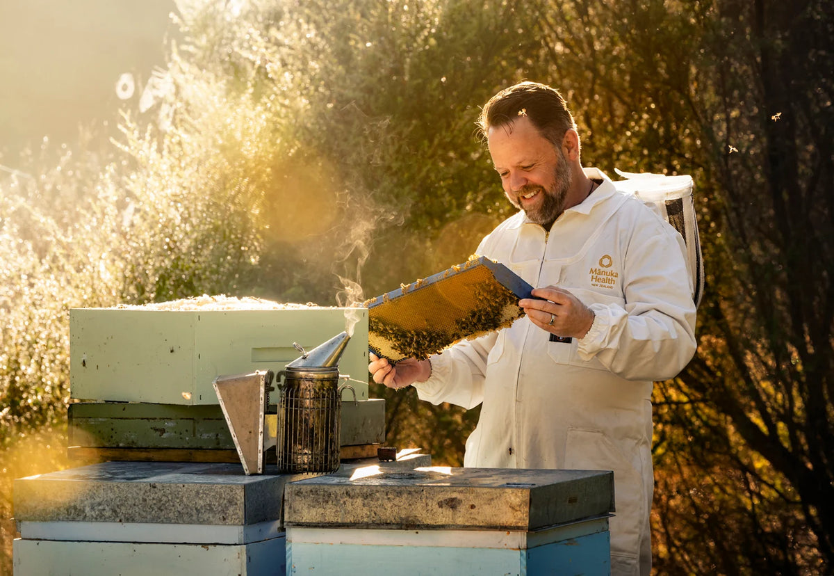 A jar of Mānuka honey on a kitchen table